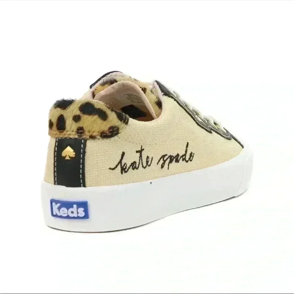 Keds beige canvas sneakers with black trim and leopard heel